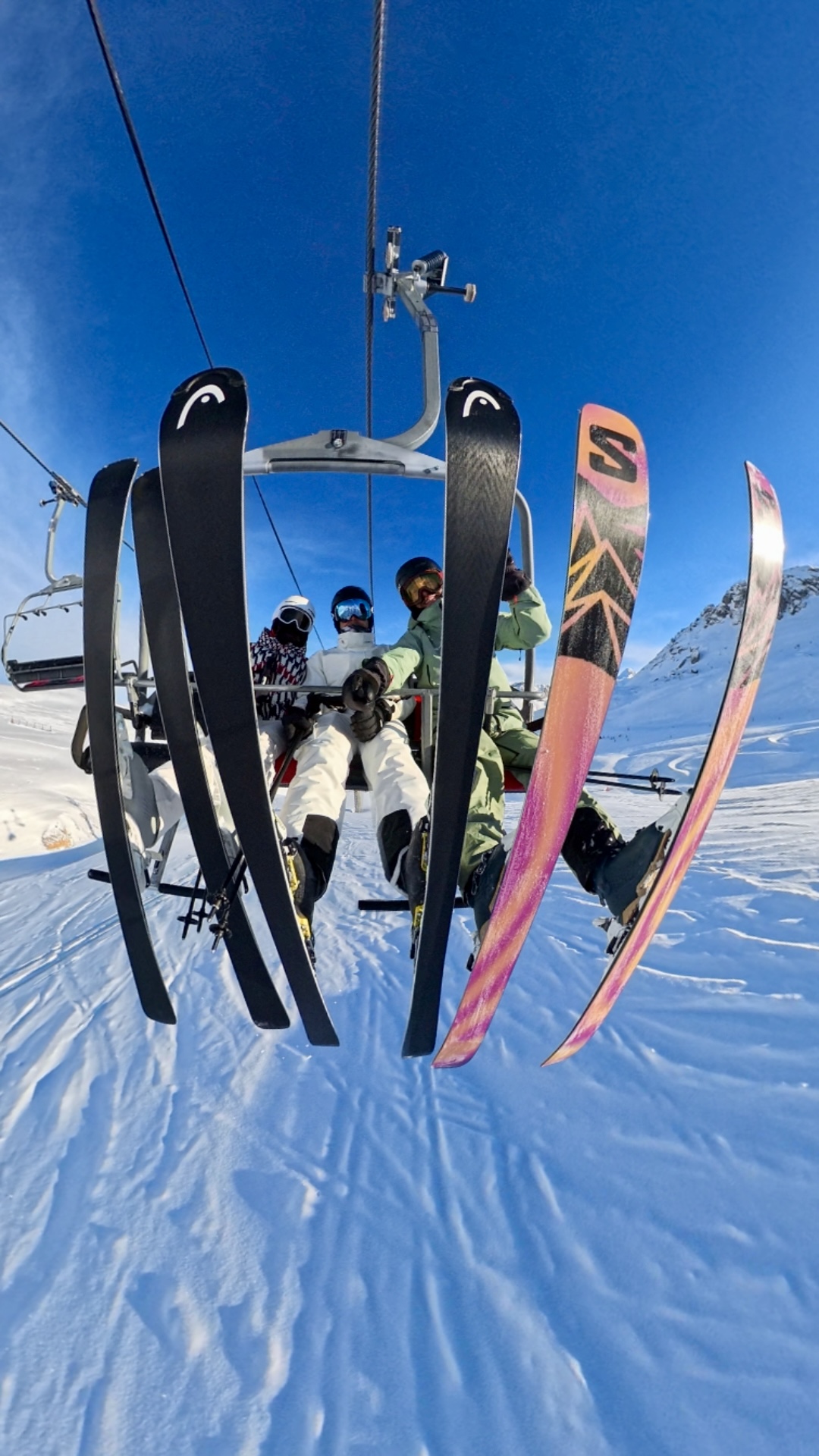 Pascal Prot with happy clients on a chairlift in Tignes