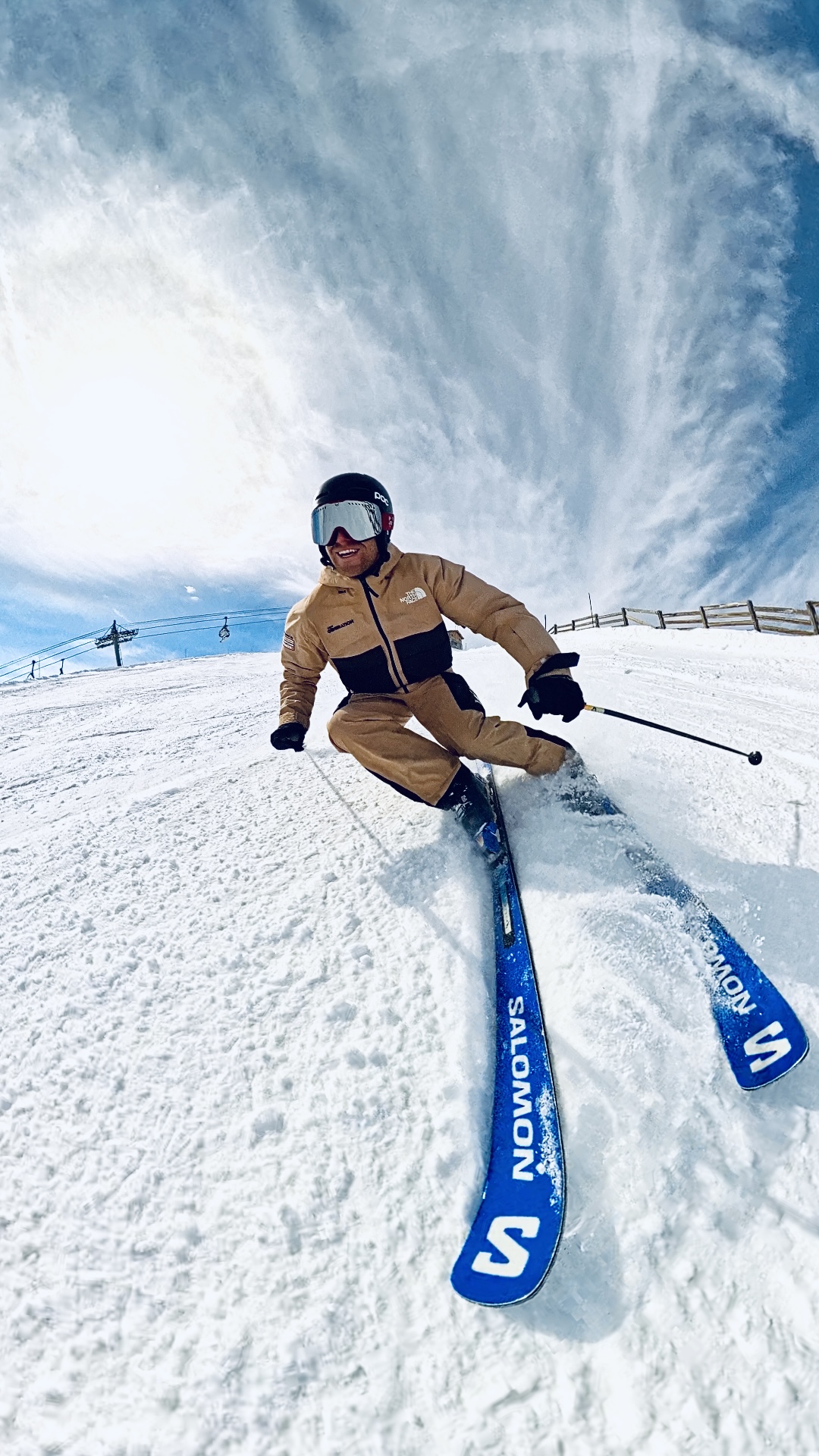 Skier with blue Salomon skis