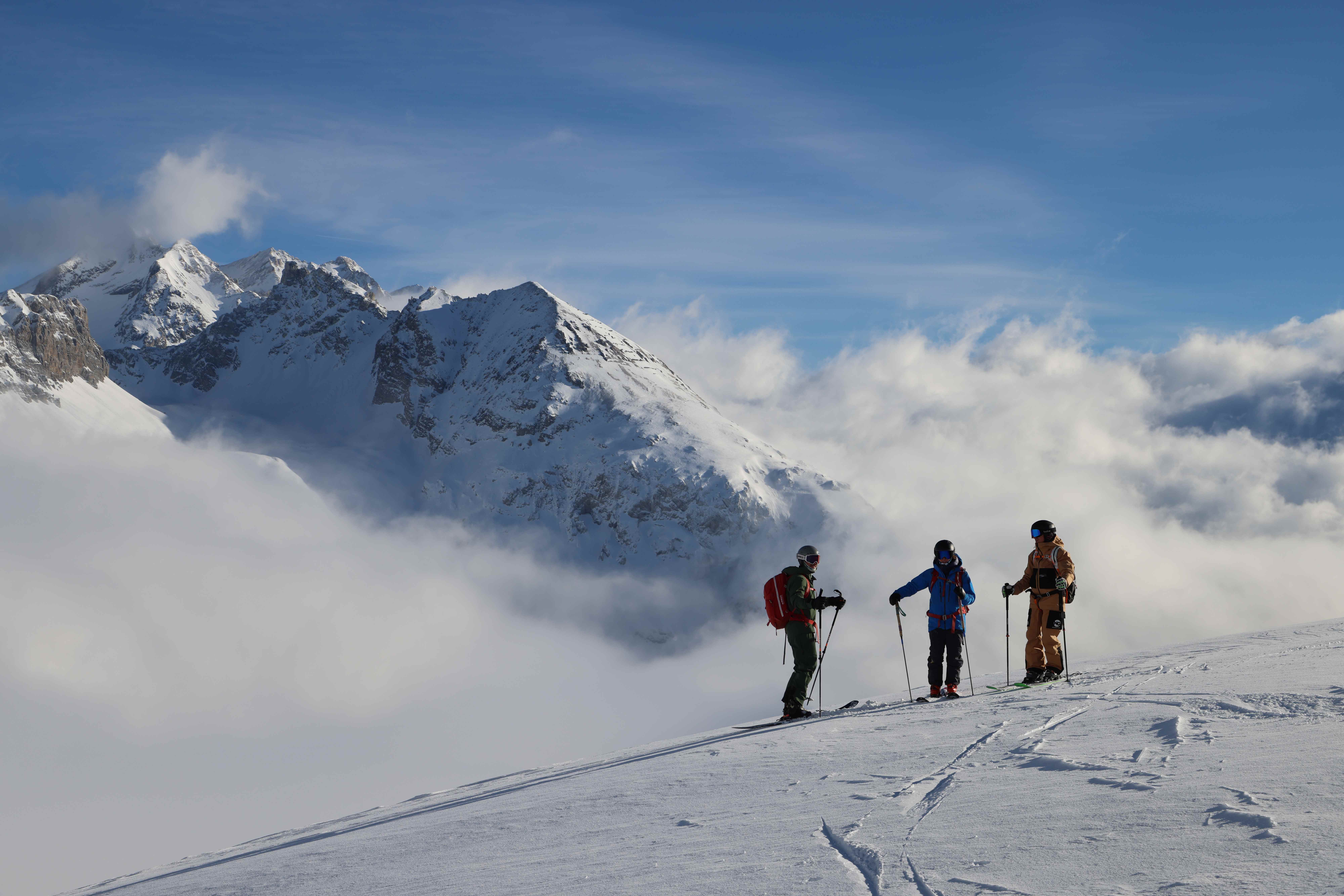 Three skiers on mountain